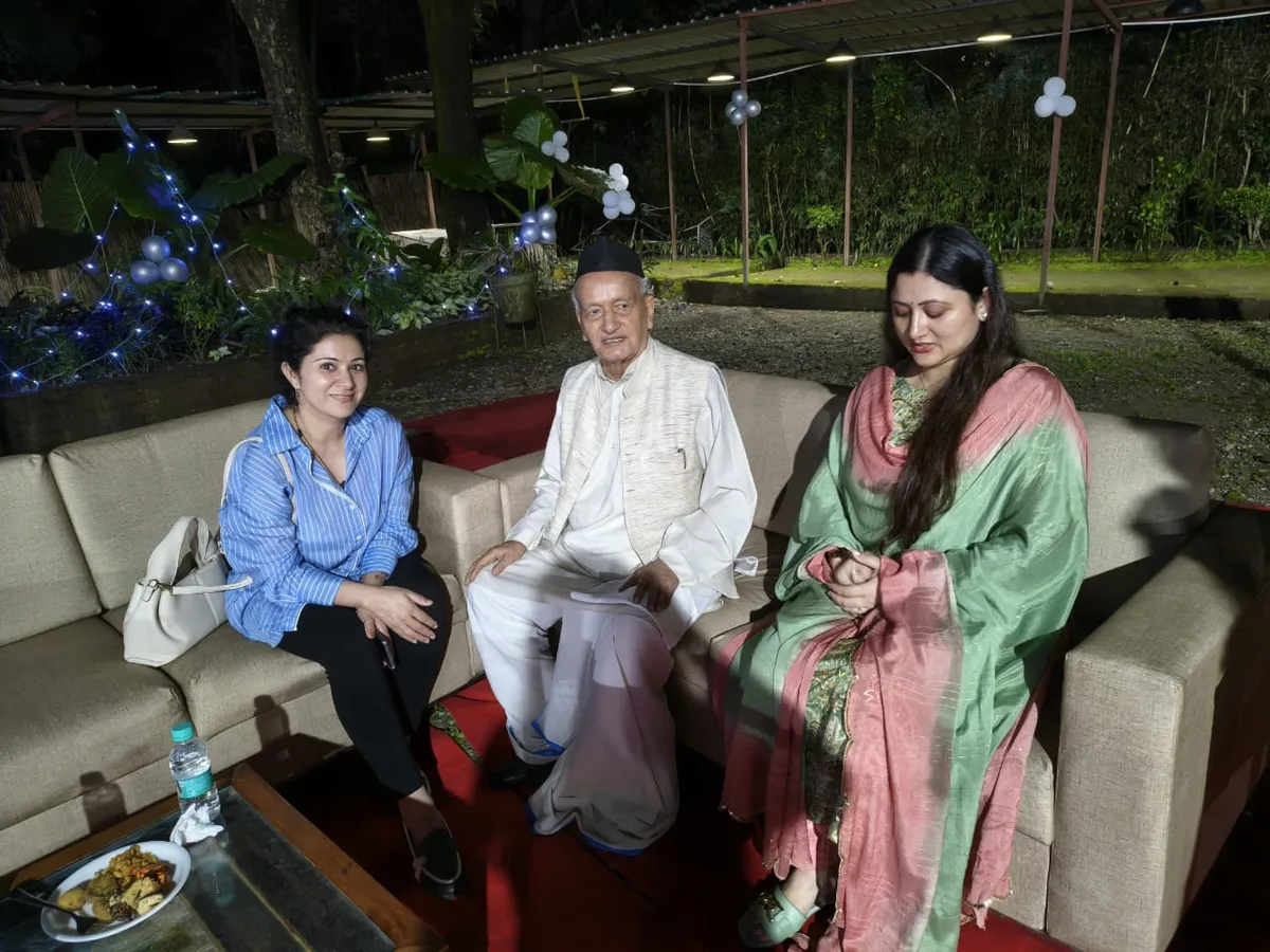 Guests seated in conversation at a Namaste FaceYoga community event