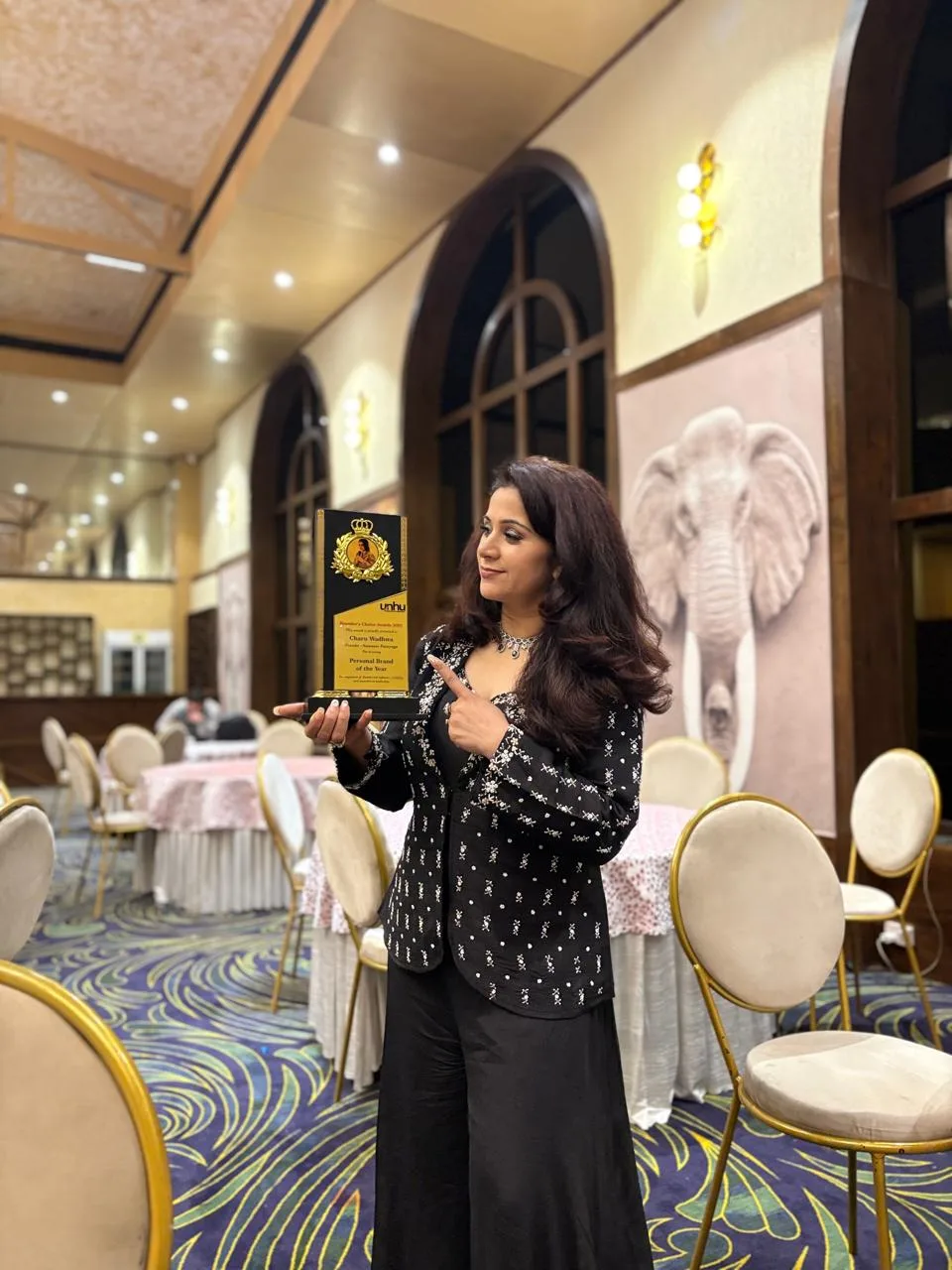 Charu Wadhwa leading a Face Yoga workshop in a hall